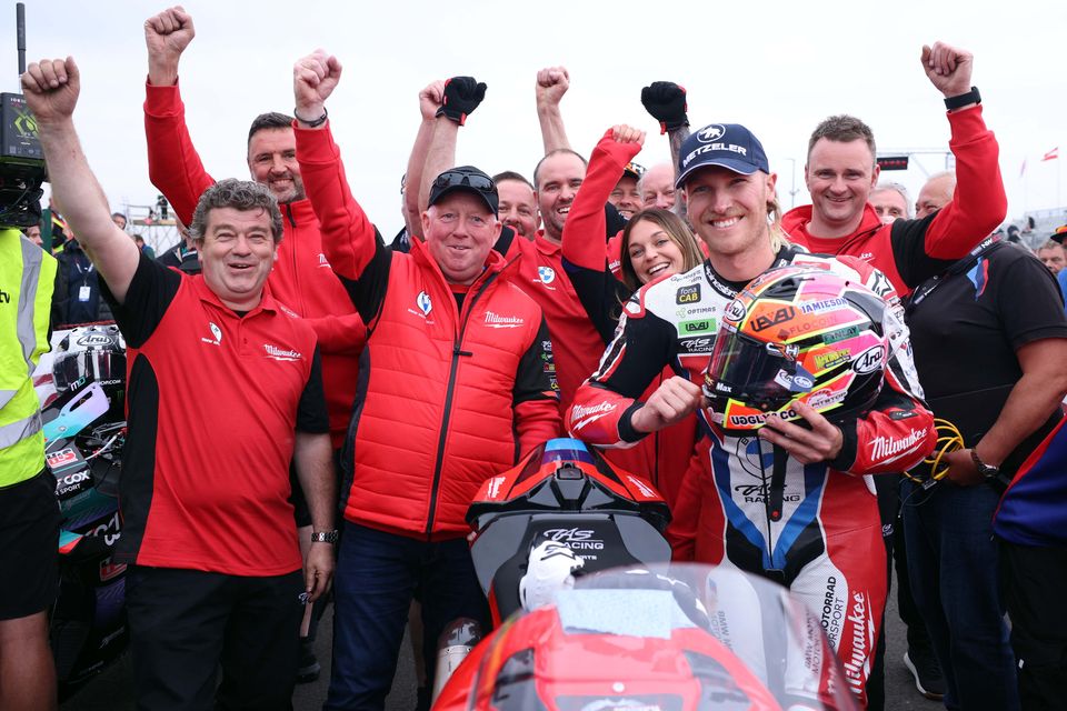 Davey Todd celebrates with his team after winning the Superstock race