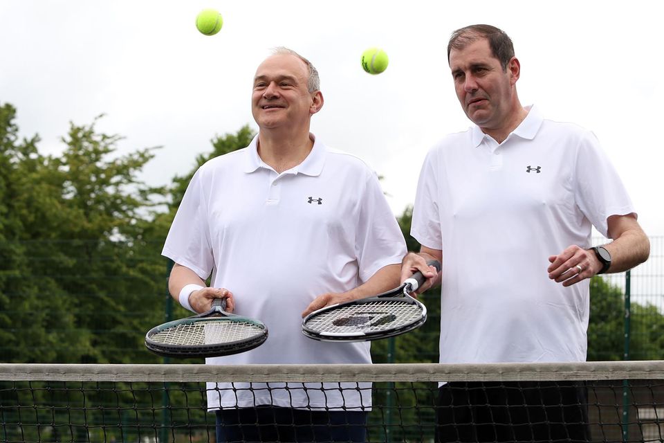 Lee Dillon, the Liberal Democrat MP for Newbury, pictured playing tennis in his constituency with his party’s leader Sir Ed Davey (Will Durrant/PA)