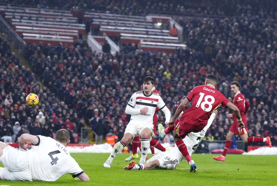 Cody Gakpo, right, scores Liverpool’s first goal (Peter Byrne/PA)