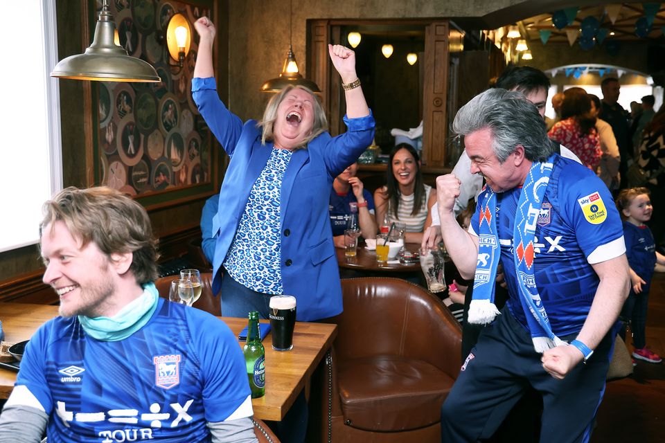 Ipswich fans celebrate their second goal against Huddersfield to win promotion to The Premiership.