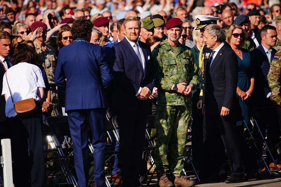 King Willem-Alexander of the Netherlands (front row, second from left) during a event at Memorial Square (Ben Birchall/PA)