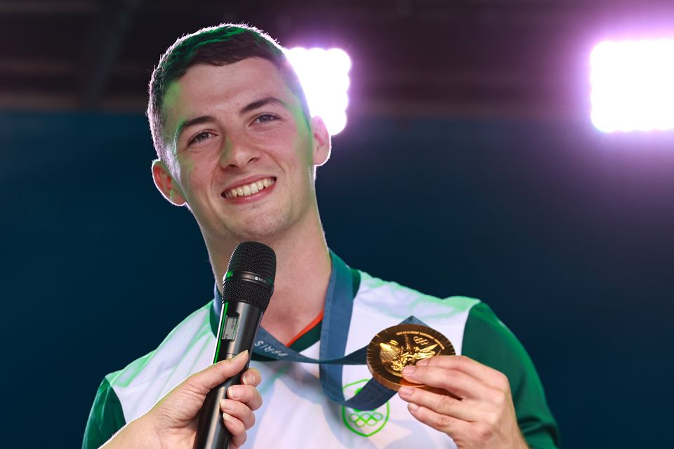 Gymnast Rhys McClenaghan wears his Gold medal (Liam McBurney/PA)