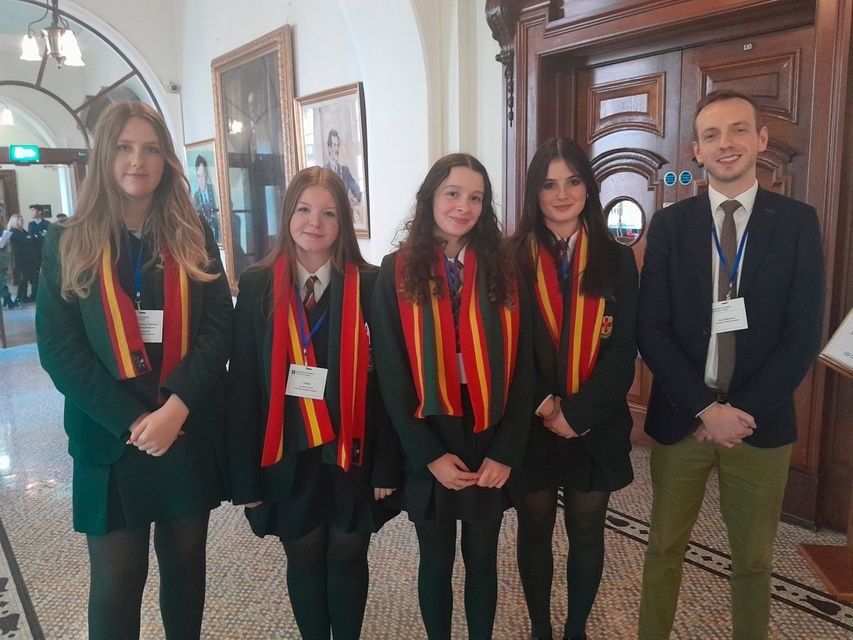 Pupils from Friends School Lisburn who attended the climate negotiation simulation at Belfast City Hall, run by the British Council NI: Molly Greenhill, Emma Convill, Emma Brown and Jessica Hayes, with teacher Dr Mark Williamson.