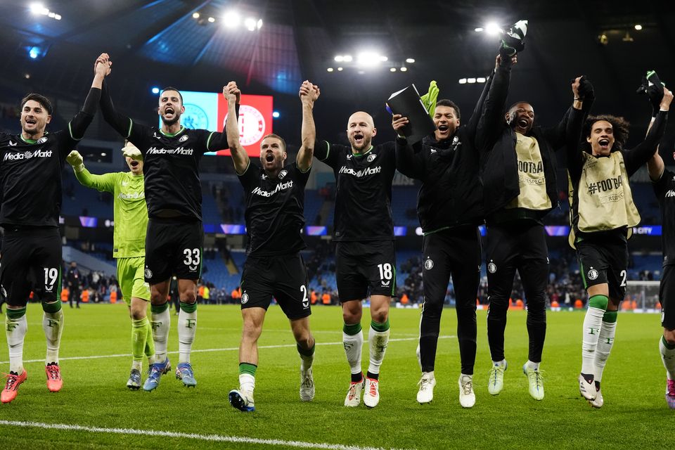 Feyenoord celebrate their draw in front of their fans (Nick Potts/PA)