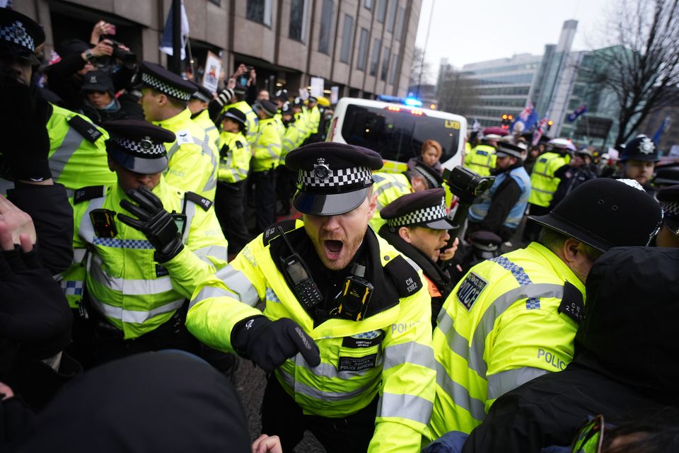 Police hold back protesters (Jordan Pettitt/PA)