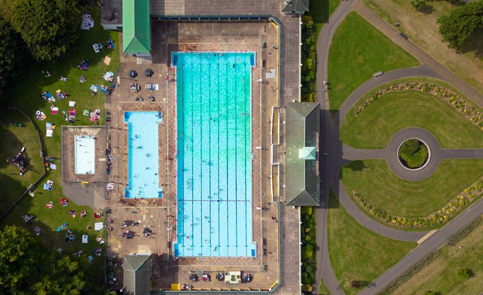 People cool off at Peterborough Lido in Cambridgeshire (Joe Giddens/PA)