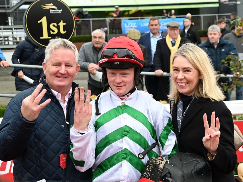 Treble winning jockey Sam Ewing celebrates his treble success on the opening day at the Down Royal Festival of Racing with his parents Warren and Debbie Ewing. Image: Pacemaker