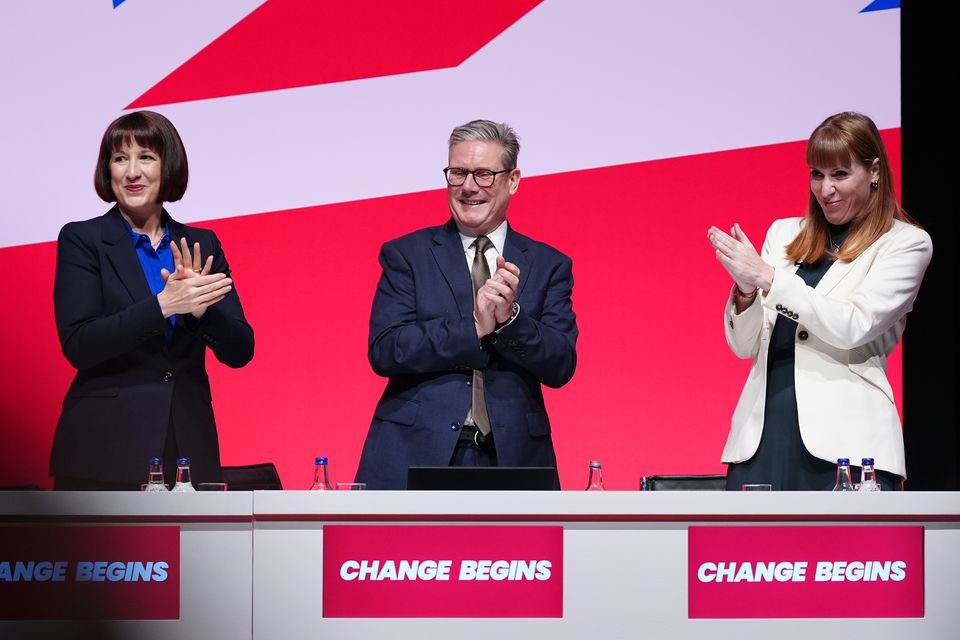 Chancellor Rachel Reeves, Prime Minister Sir Keir Starmer and Deputy Prime Minister Angela Rayner clap their hands during the Labour Party conference in Liverpool (Peter Byrne/PA)