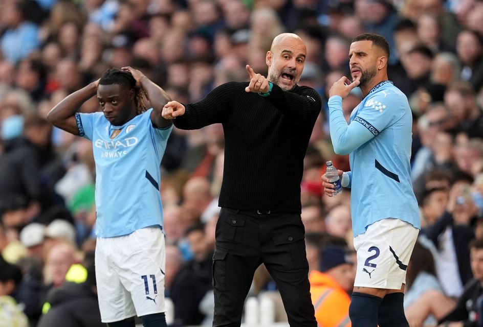 Manchester City manager Pep Guardiola (middle) says Kyle Walker (right) wants to leave the club (Martin Rickett/PA)