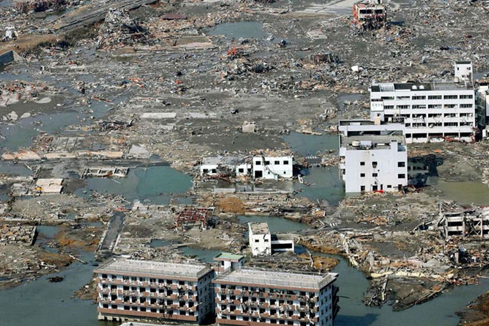 Rubble is scattered across the wide areas of the town of Minami Sanriku, northeastern Japan, on Sunday March 13, 2011, two days after a powerful earthquake and tsunami hit the the country's northeastern coast. (AP Photo/Kyodo News) MANDATORY CREDIT, NO LICENSING ALLOWED IN CHINA, HONG  KONG, JAPAN, SOUTH KOREA AND FRANCE
