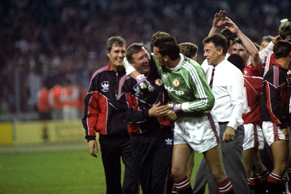 Sir Alex Ferguson celebrates with goalkeeper Les Sealey after winning the FA Cup in 1990 (PA archive)