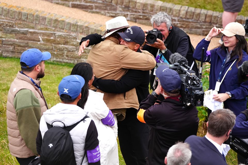 Xander Schauffele celebrates with his father Stefan after winning the 152nd Open at Royal Troon (Jane Barlow/PA)