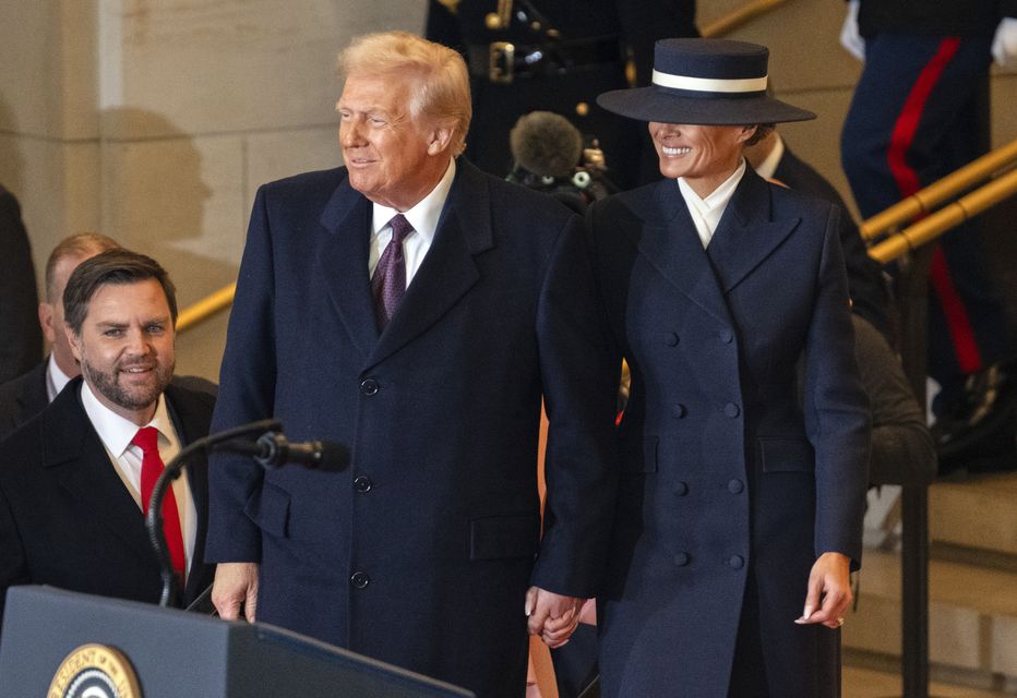 President Donald Trump and first lady Melania Trump arrive in Emancipation Hall after the 60th Presidential Inauguration at the US Capitol in Washington (Ron Sachs/Pool Photo via AP)