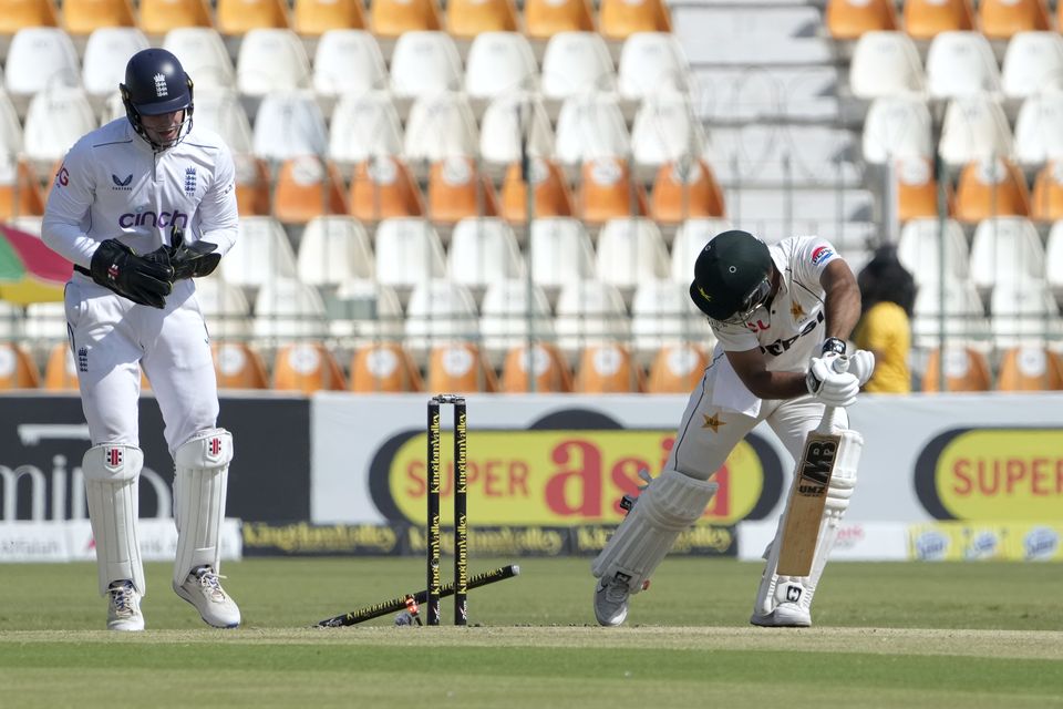 Abdullah Shafique is bowled by Jack Leach (K.M. Chaudary/AP)