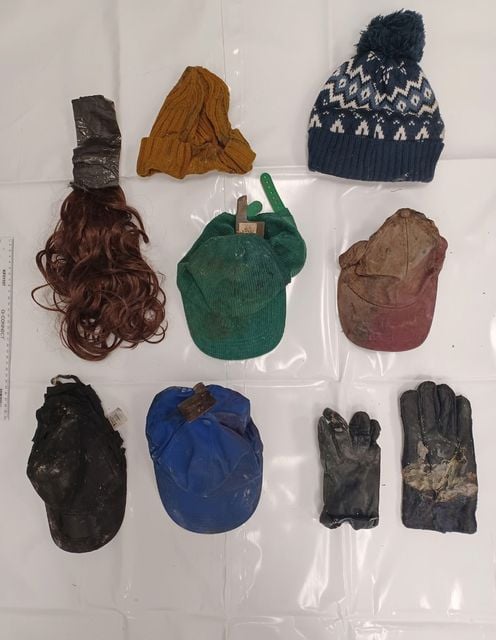 Hats, gloves and a wig with tape attached were among items found in Amblecote Playing Field and near the burnt out Peugeot 206 on the side of the M61 (Met Police/PA)