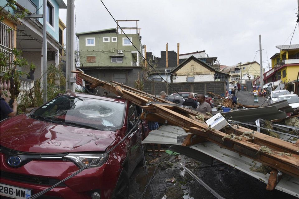 Debris in a street in the Indian Ocean French territory of Mayotte (Ministere de l’Interieur/DICOM via AP)