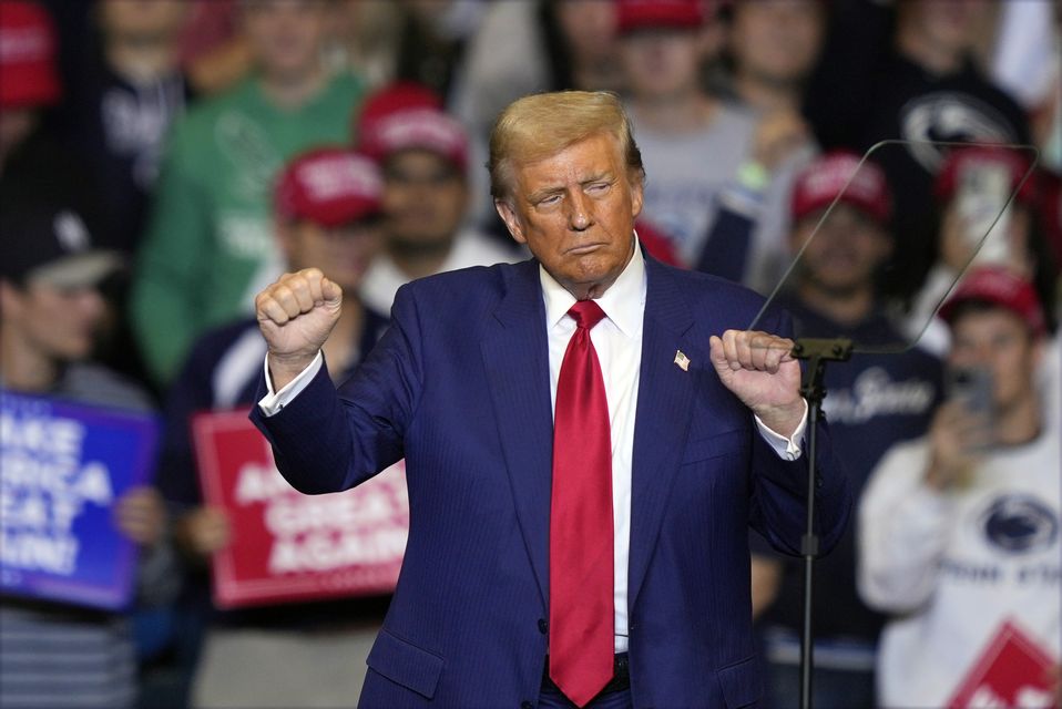 Donald Trump dancing during a campaign rally at the Bryce Jordan Centre, Pennsylvania, on Saturday (Matt Rourke/AP)