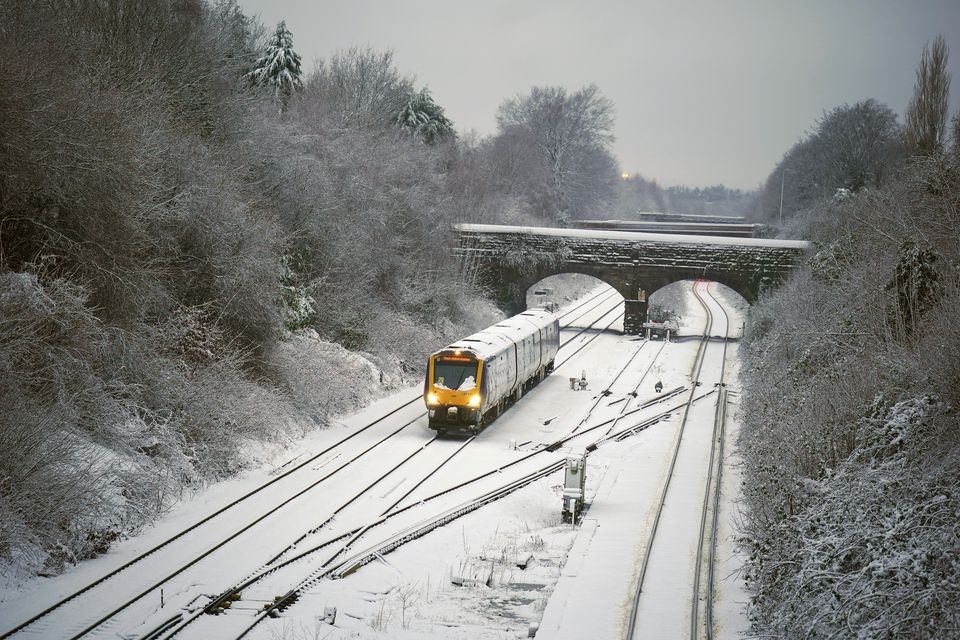 Trains were subject to delays across Merseyside due to snowfall (Peter Byrne/PA)