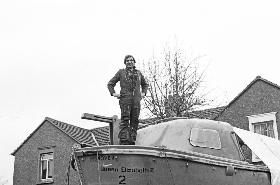 Cunard hopes to track down David Lawrence, who features in a 1982 photo with a lifeboat from the QE2 (Mirrorpix/PA)