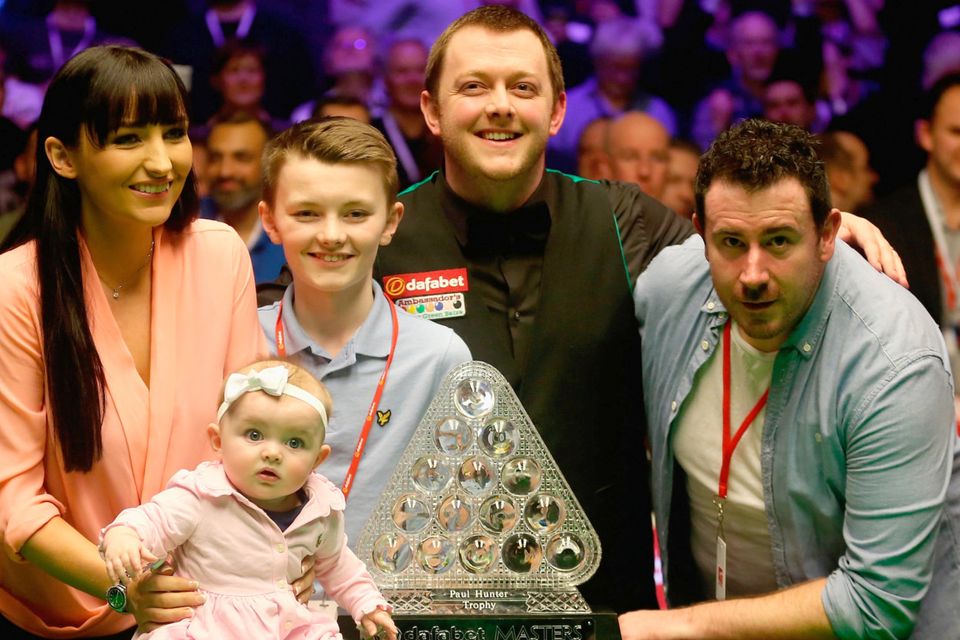 Mark Allen celebrates victory with wife Kyla, stepson Robbie, and baby Harleigh after his triumph in the Dafabet Master’s Final against Kyren Wilson