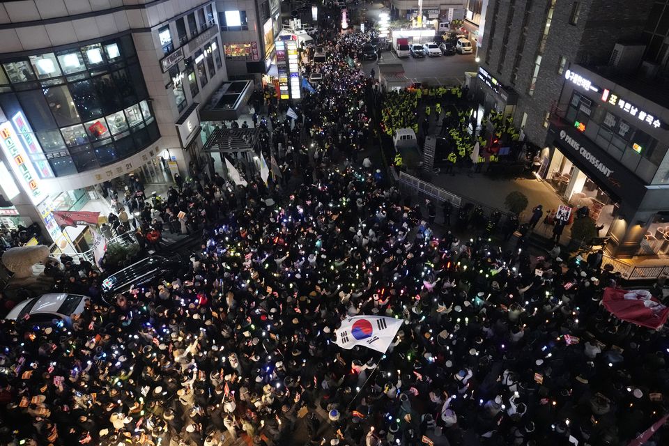 Participants stage a rally to demand South Korean President Yoon Suk Yeol’s impeachment in front of the headquarters of the ruling People Power Party in Seoul, South Korea (Ahnn Young-joon/AP)