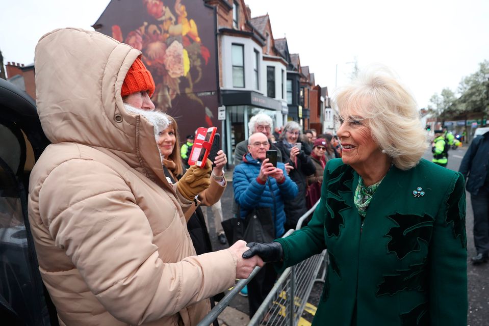Queen Camilla meets members of the public during a visit to Lisburn Road in Belfast. Image: Liam McBurney/PA Wire
