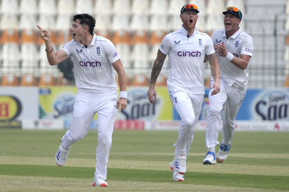 Matthew Potts, left, celebrates after taking the wicket of Salman Agha (KM Chaudary/AP)