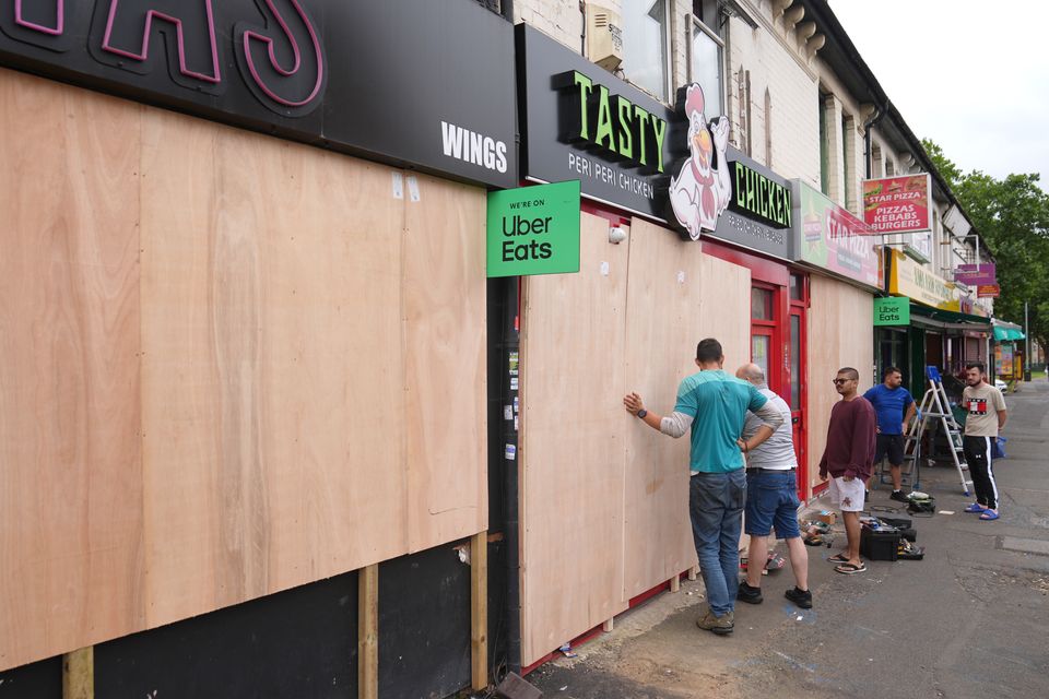 Shops have closed early and removed valuables ahead of expected rioting (Joe Giddens/PA)