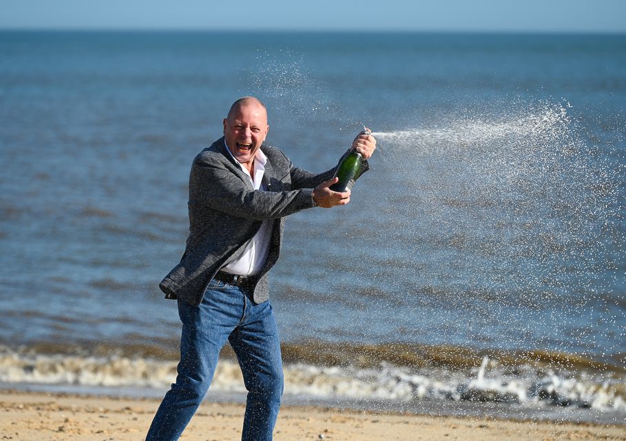 IT worker John Lingard celebrates his £500,000 lottery win a year after having cancer surgery (National Lottery/PA)